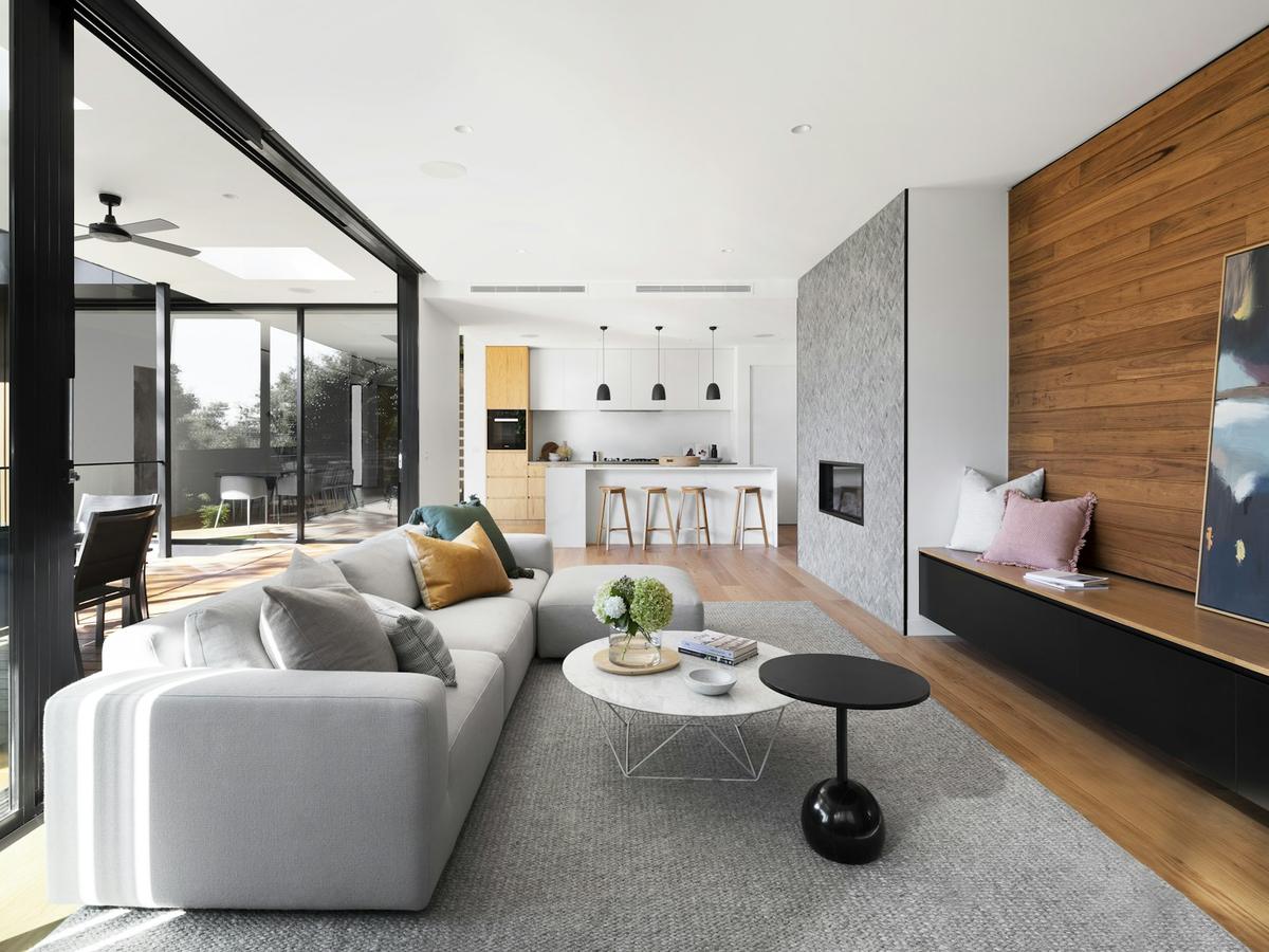 Bright open-plan living room with designer furniture